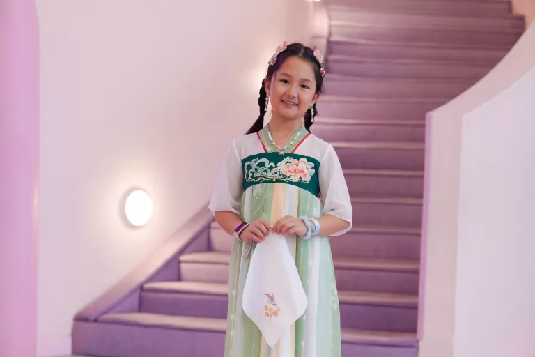 Girl in princess Hanfu dress on the lavender stairs of UFOREA's Makeover Castle
